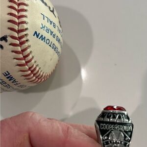 Silver and Red Championship Ring and baseball